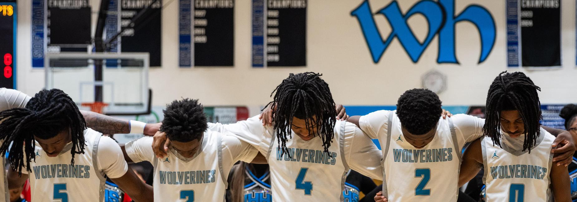 Five boys basketball players before a game