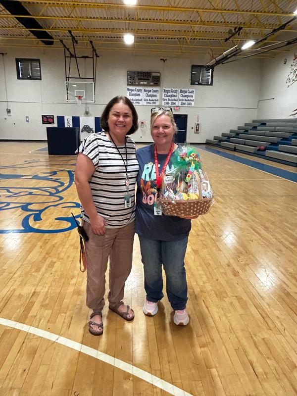 Ms. Glenda Presenting Ms. Leigh Ann the Staff Member of the Month Award
