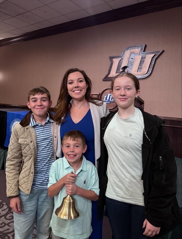 sarah denning poses with her children