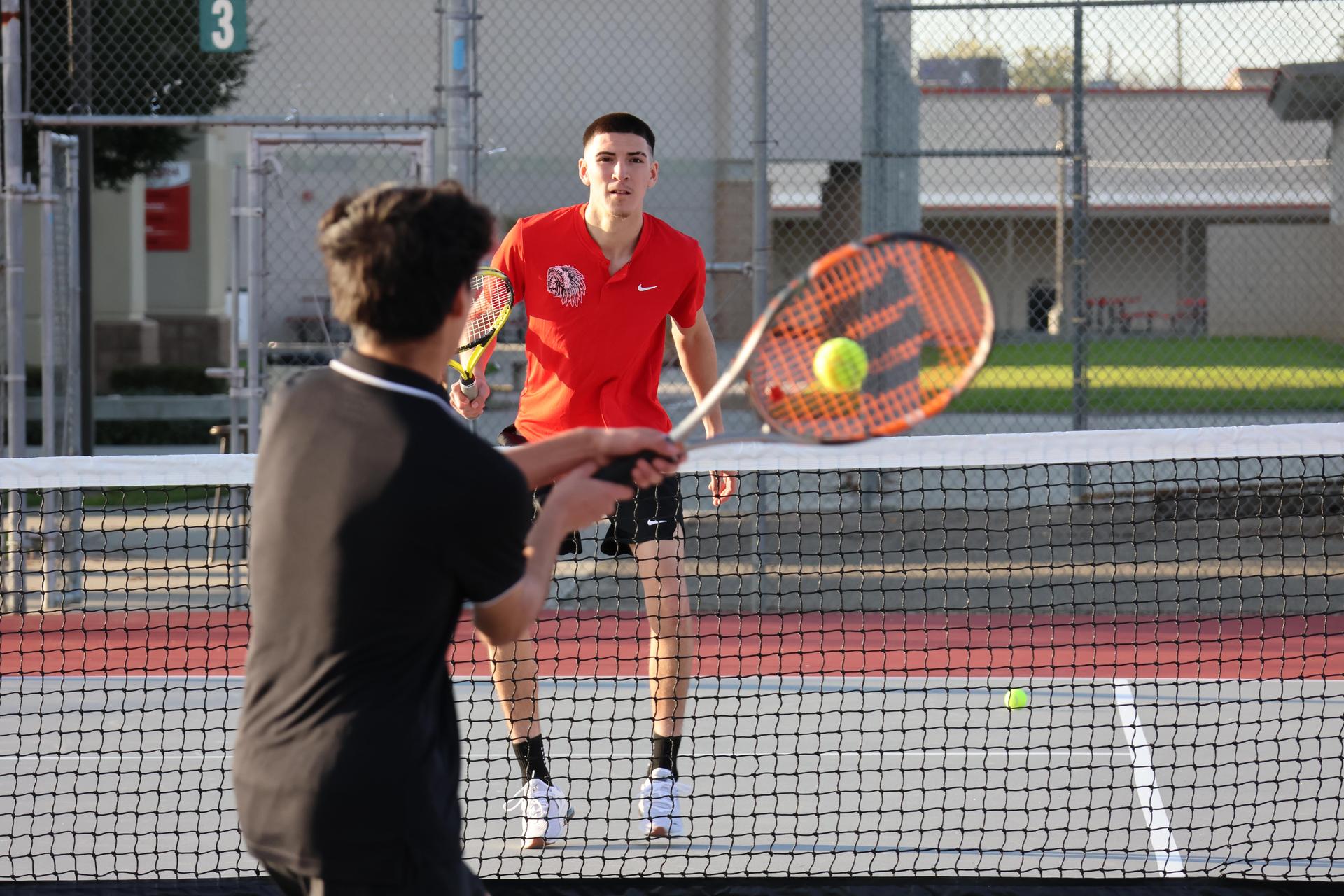 CUHS Boys playing tennis against coalinga