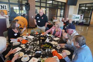 Sandi (Stager) Wake's family sits together at a table near the front of the room.