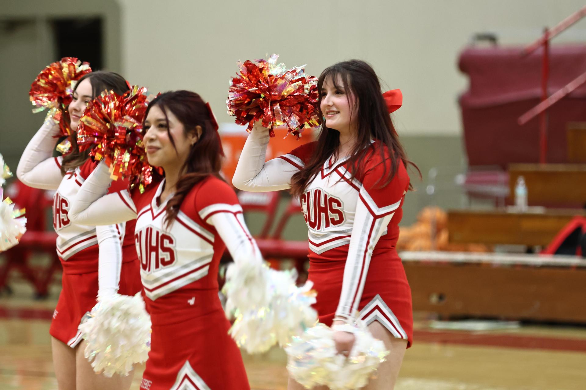 Varsity boys playing basketball against yosemite