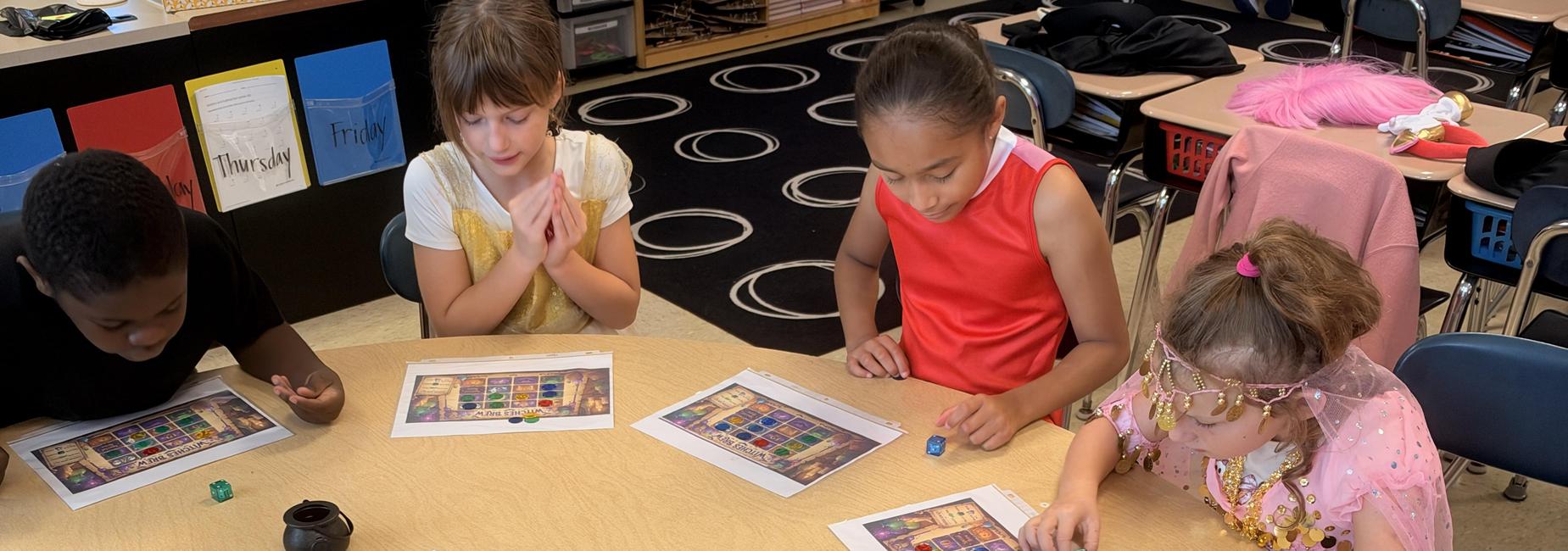 4 students playing a game at a table
