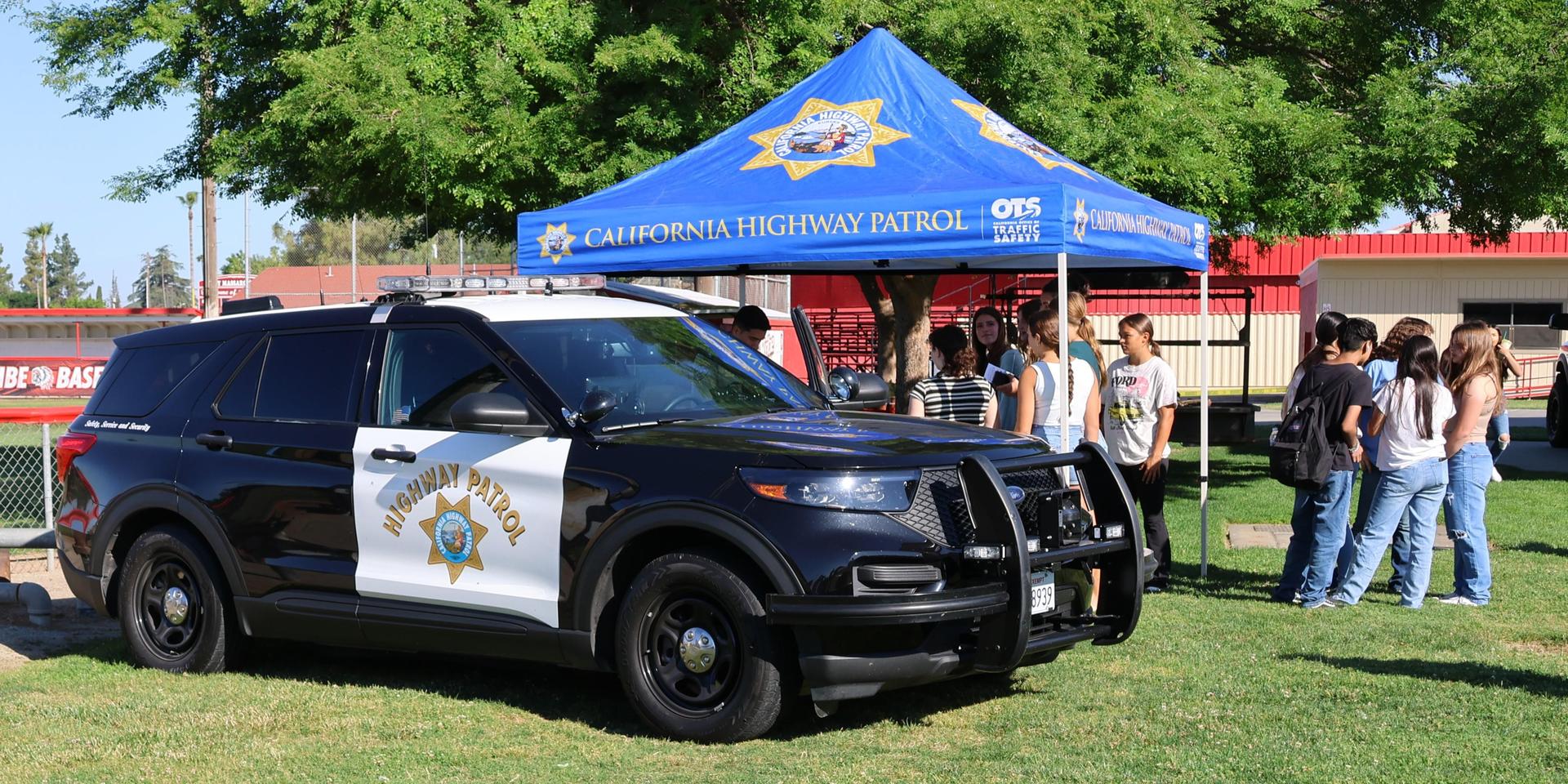 Highway patrol officers speaking to students