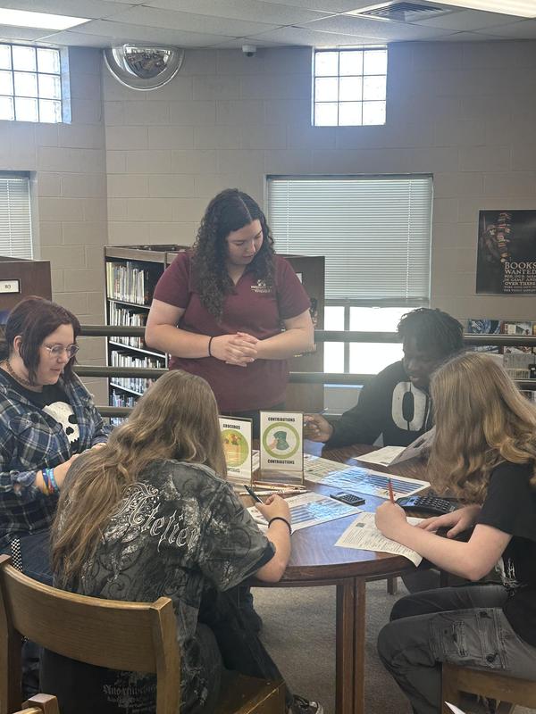Extension officer helping students with budget