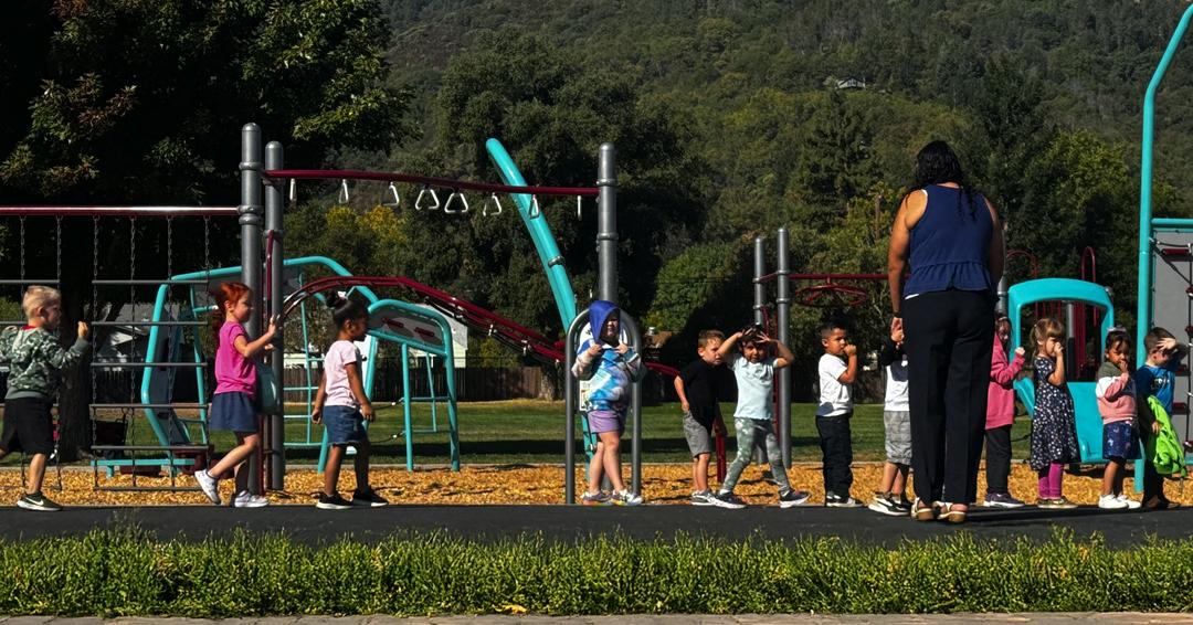TK kids walking at playground