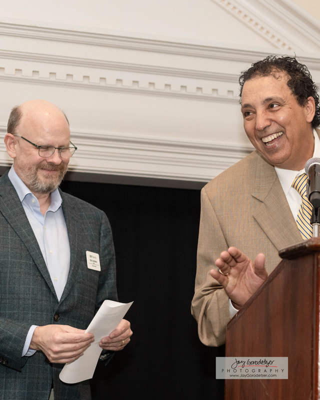 Athelete Director and Head of School presenting an Award.