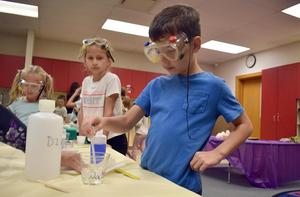 young students conducting science experiments