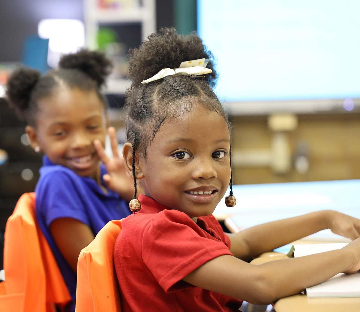Horizon Science Academy Austintown student working and smiling in class