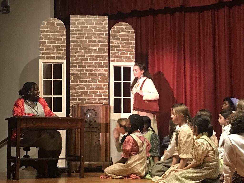 Orphanage scene with Miss Hannigan and Grace