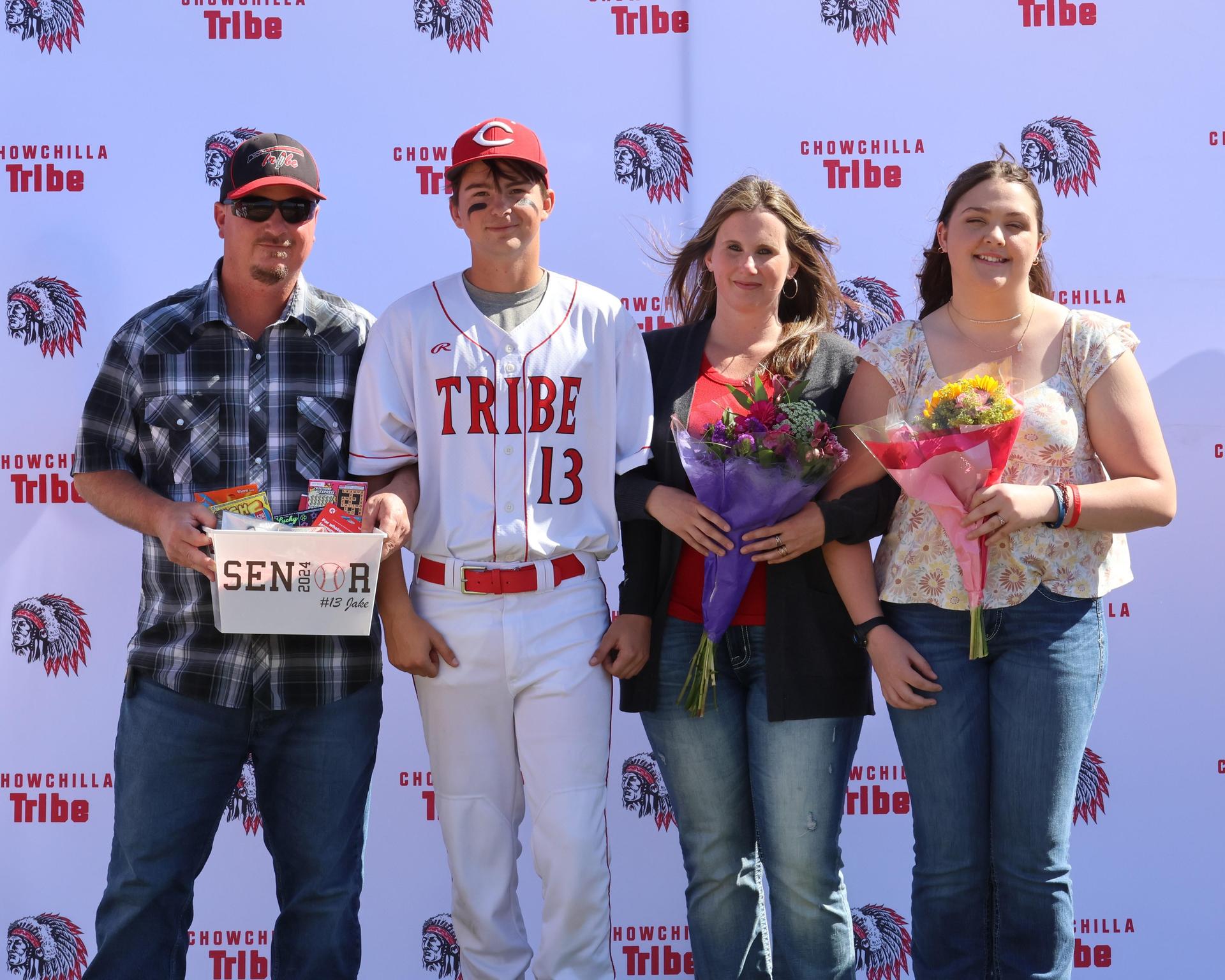 Seniors Posing With Teammates, Coaches, And Family