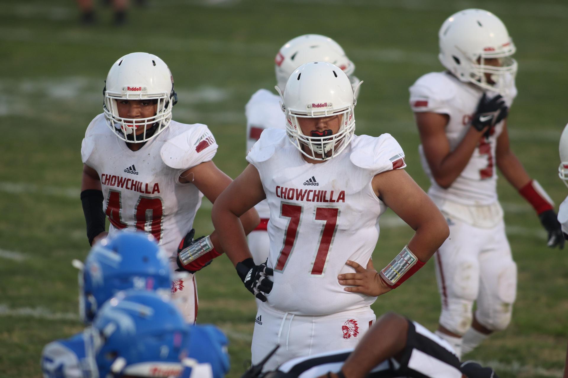 Junior Varsity football players in action against Caruthers