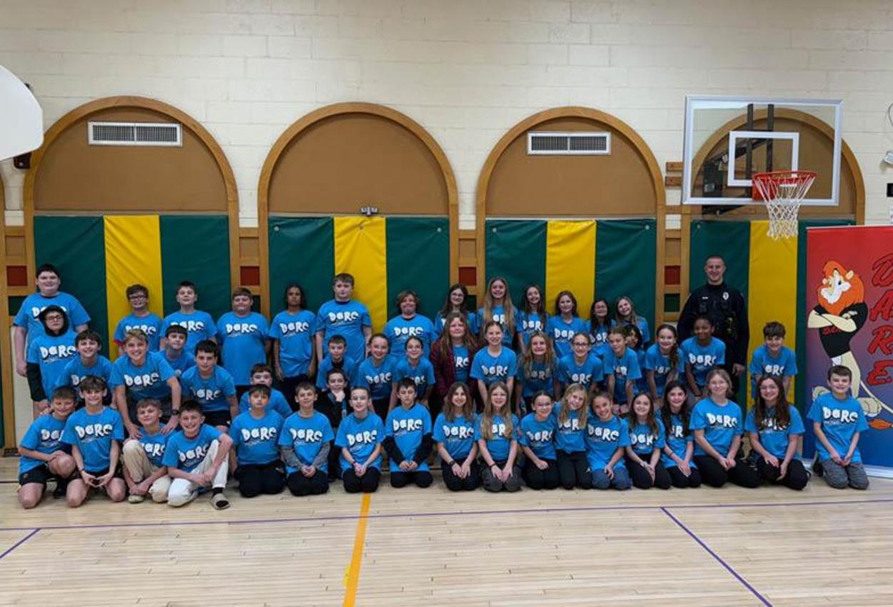 Level Green 5th-graders celebrate completion of the DARE program in the multipurpose room