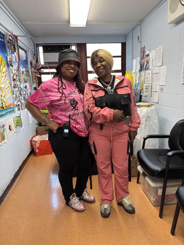 Parent coordinator and parent wearing pink