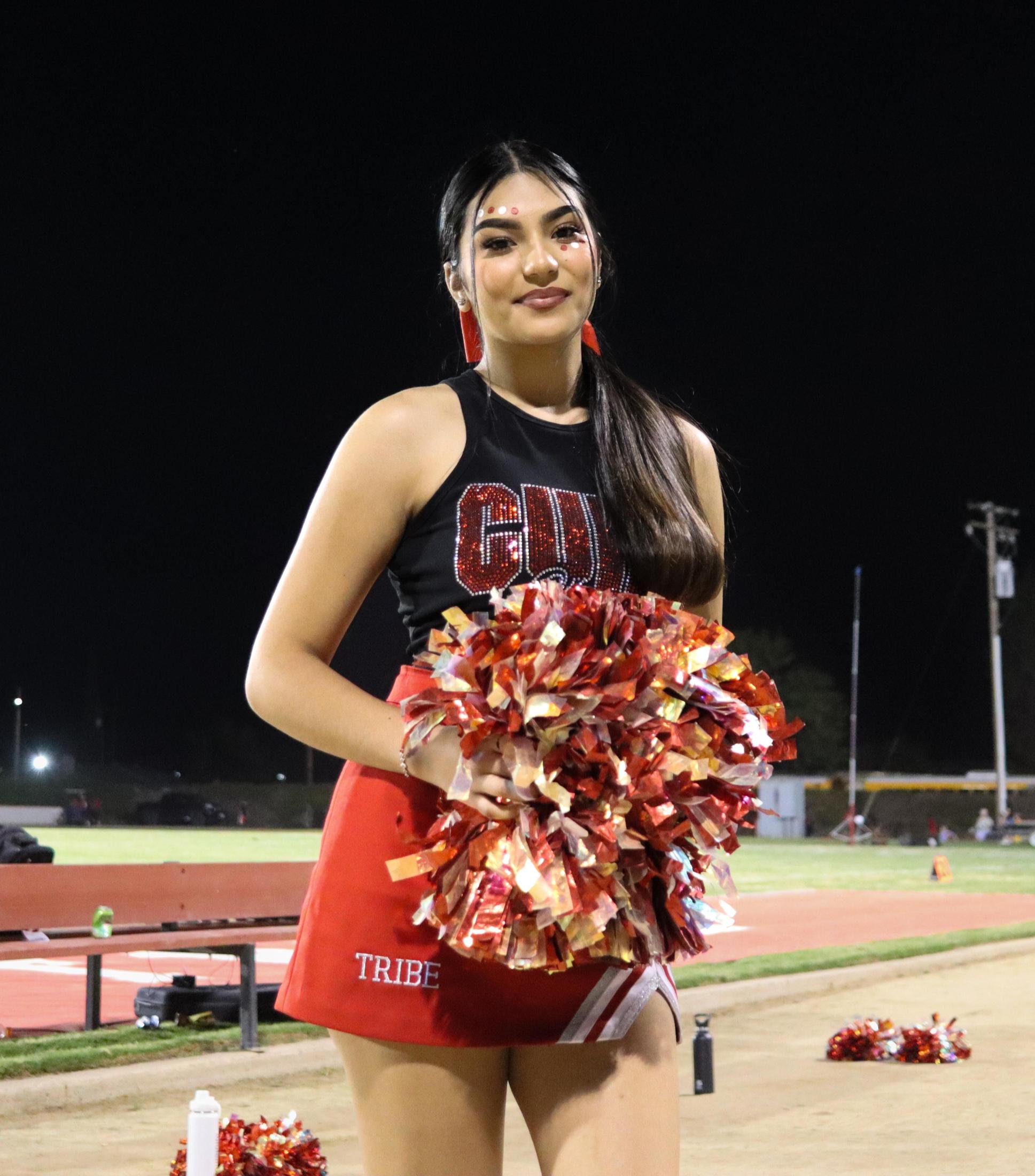 Varsity girls cheering at the Parlier football game