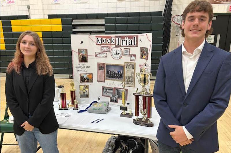 Cienna Oien (grade 11) and Nate Casey (grade 10) work the Mock Trial table