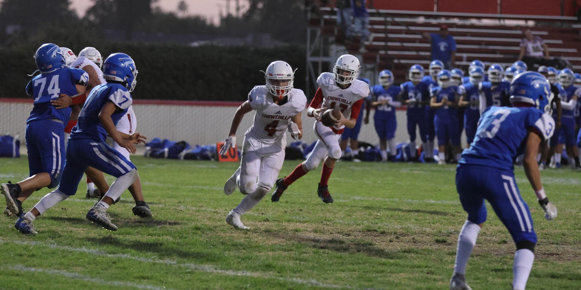 Junior Varsity football players in action against Caruthers
