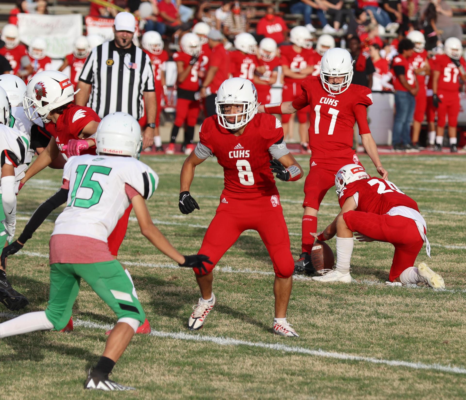  junior varsity football players in action against riverdale