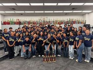 Garey high schools students about 40 are posing for a picture after wining review