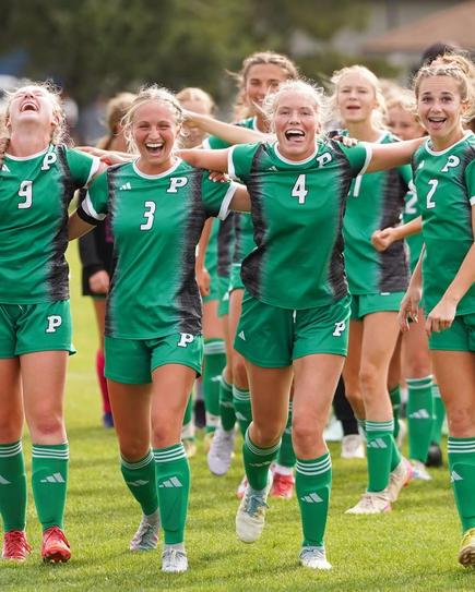 High School Girls Soccer Players Celebrating.