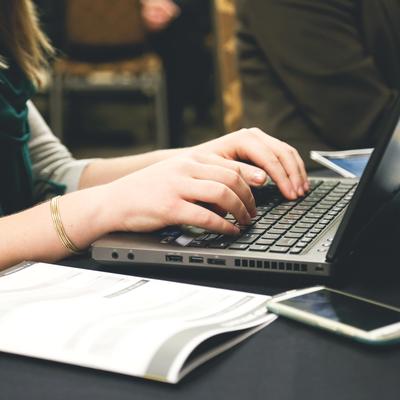 woman typing on computer