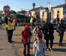 Kids and staff cross the street