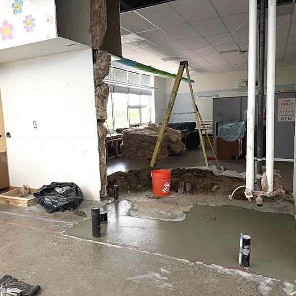 fresh concrete poured for Room 10 restroom