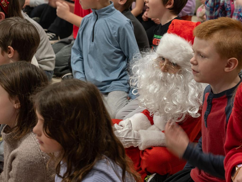 A student wearing a Santa costume.