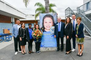 Rebecca Chai poses for a photo with Board Members Helen Hall and Larry Redinger, Superintendent Dr. Taylor, and Executive Cabinet.
