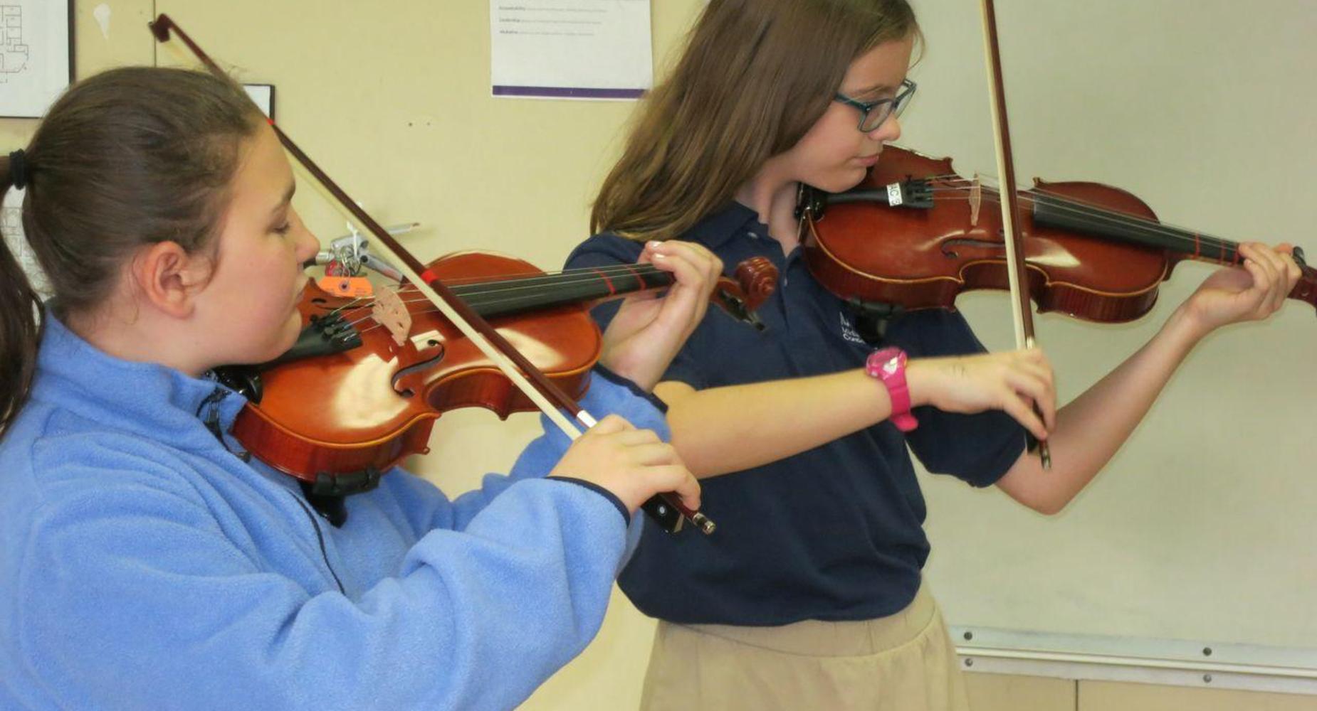 Girls playing violin