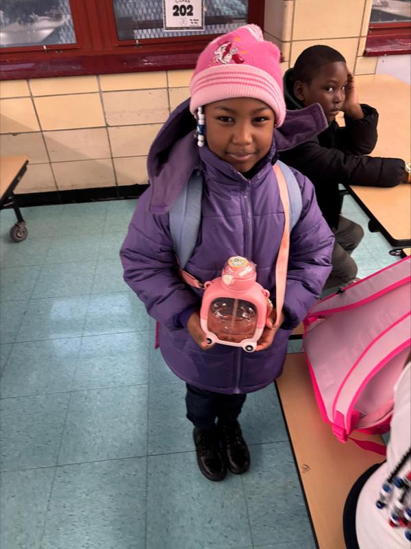Student with a reusable bottles instead that acts as a bag