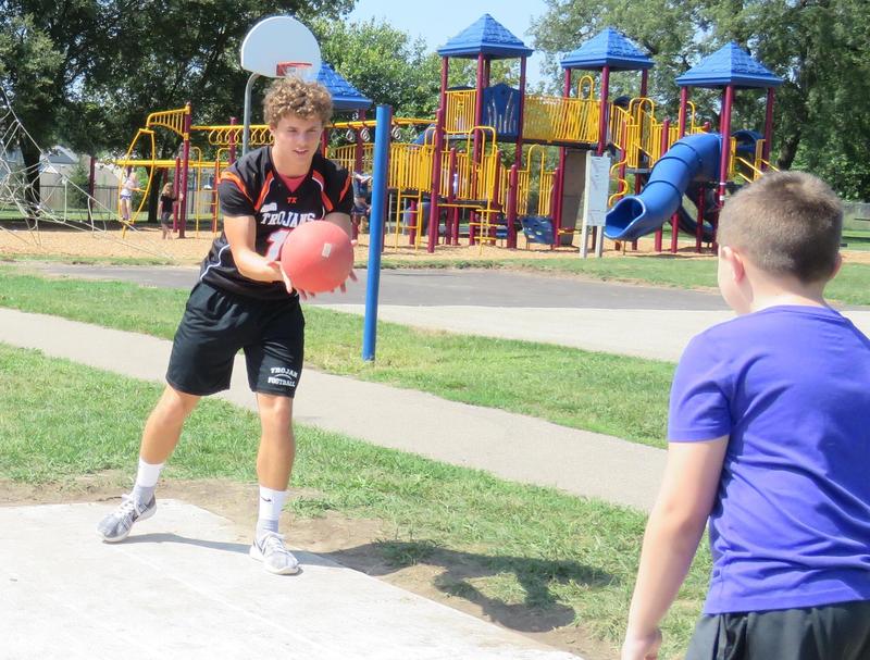 TKHS Football Players Gear Up as Playground Buddies Lee Elementary