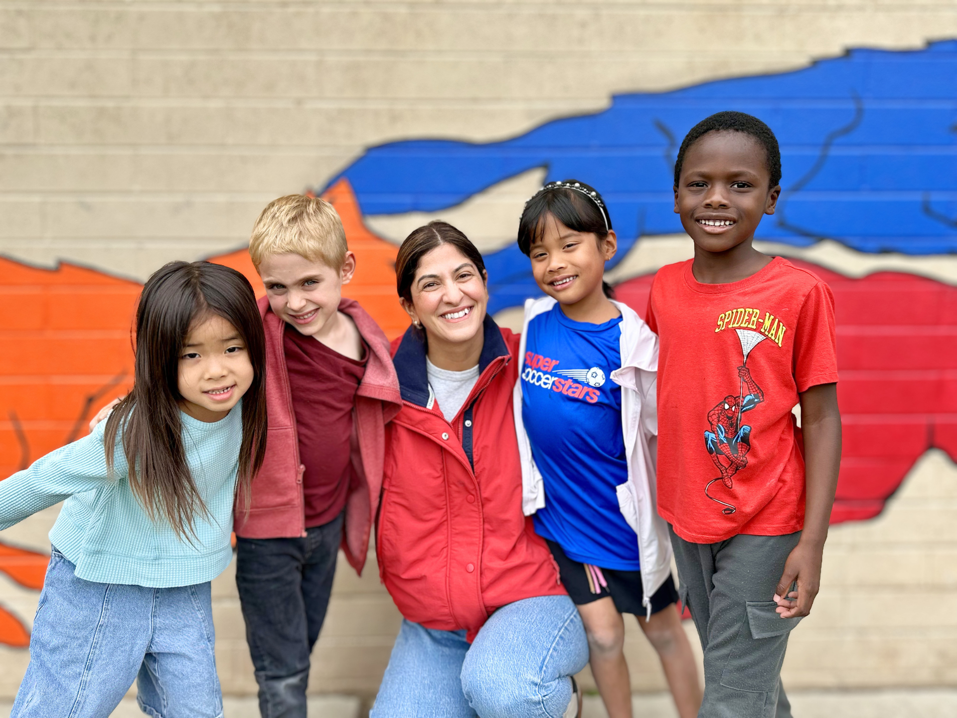 Valley Charter Elementary School principal, Parinaz Banks, smiling with students