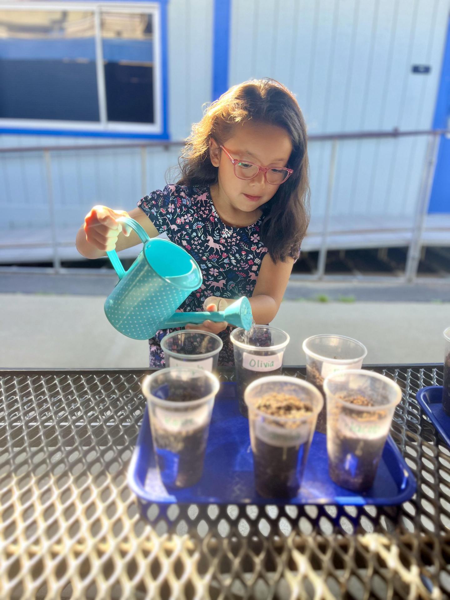 girl watering plants