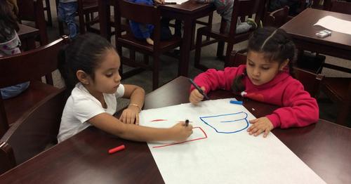 Students coding with Ozobots.