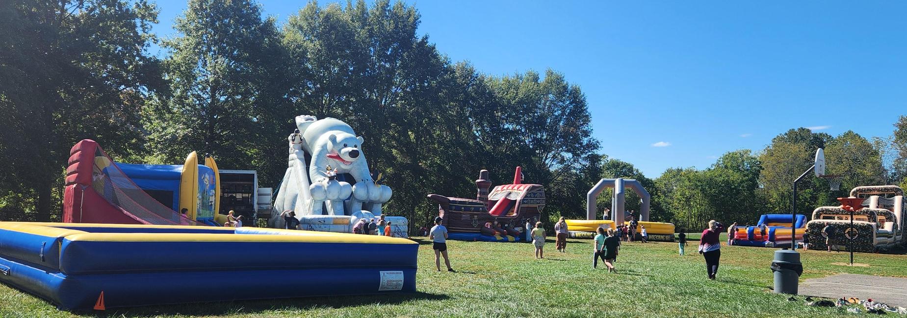 Students enjoying inflatables from the Great American Fundraiser.