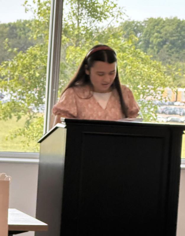 Kylie reading her poem