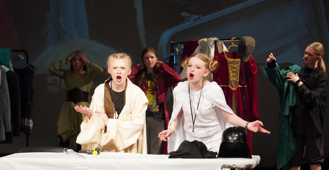 Dressed in Star Wars costumes, two students perform a scene in the spring play.