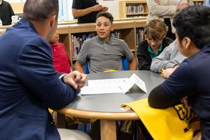 Students speak with a US Steel rep