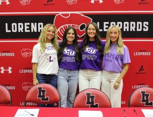 Four students satding in from of a red and black Lorena Leopard back drop