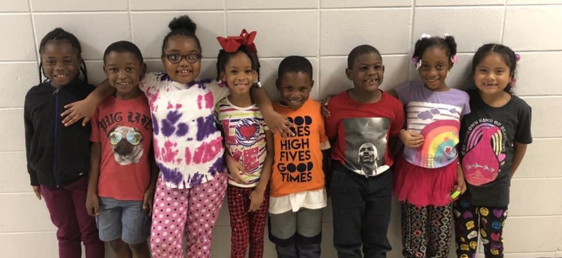 kids lined up smiling