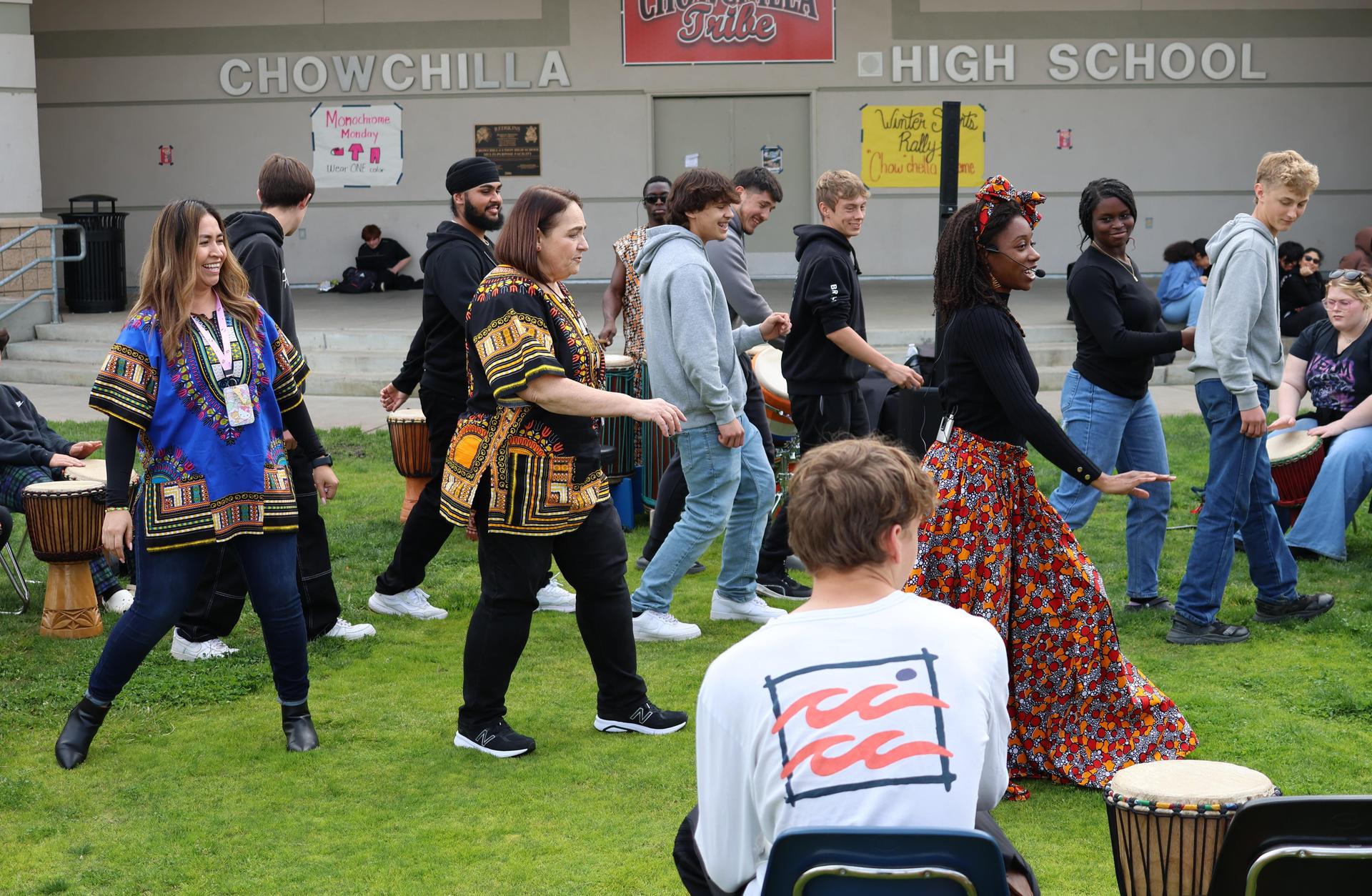 students and staff participating with the African Drum Interactive