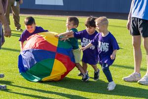 special education students participate in game day pushing ball around