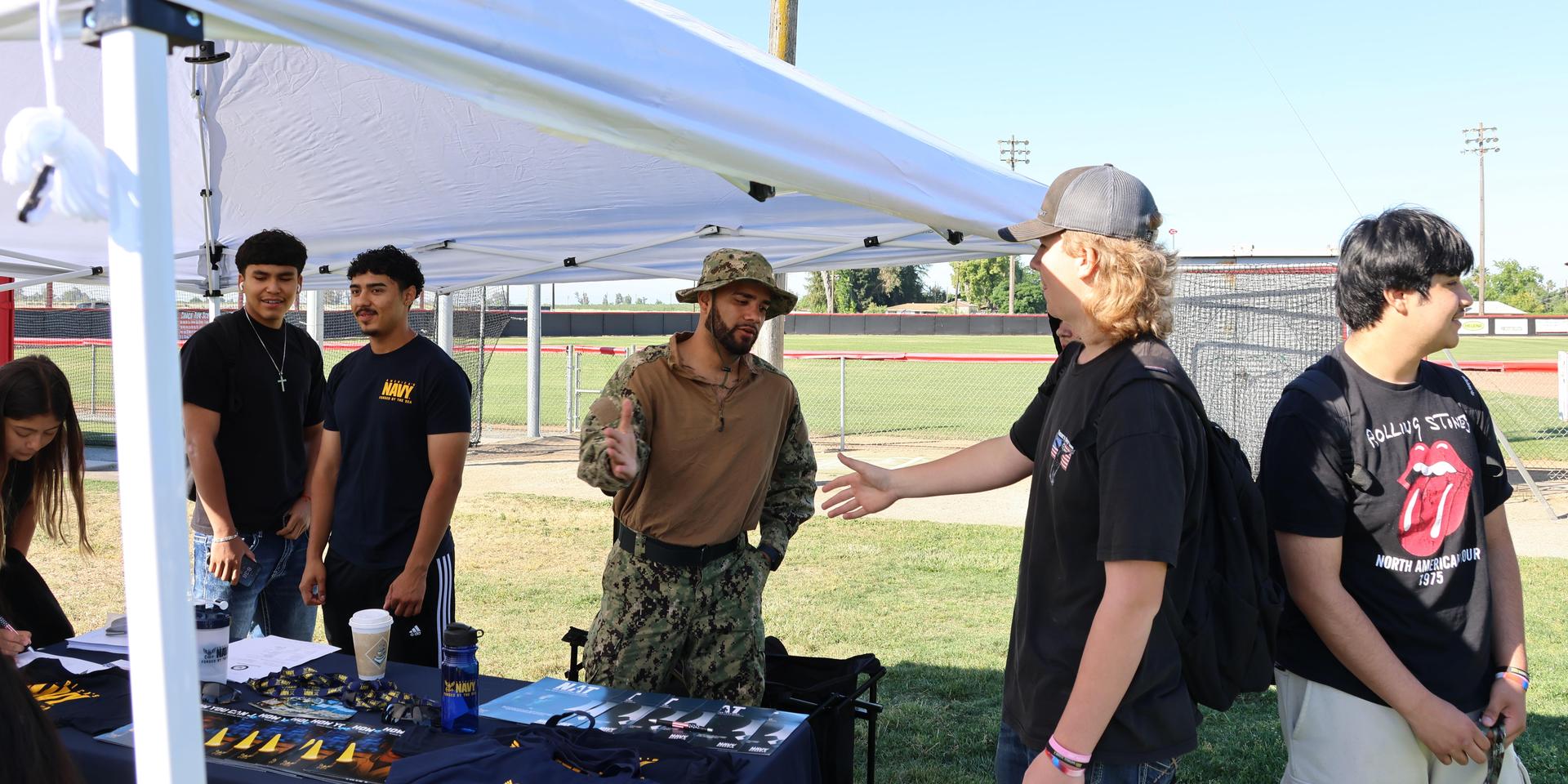 Navy recruiters speaking to students