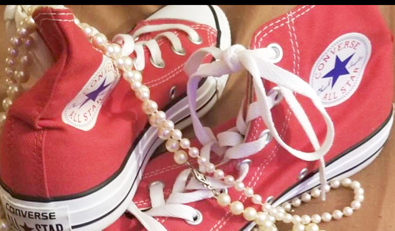 Red canvas high top sneakers and a string of pearls