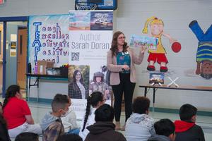 Sarah Doran reads "The Peppered Sky" to students