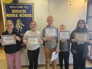 five students smile while holding certificates