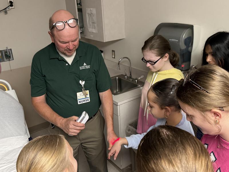 student using technology to see veins