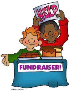 kids with fundraiser table