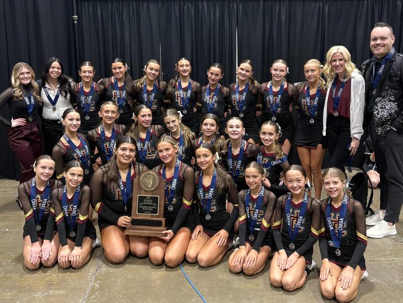 HCMS Cheer Team and Coaches hold the IESA trophy
